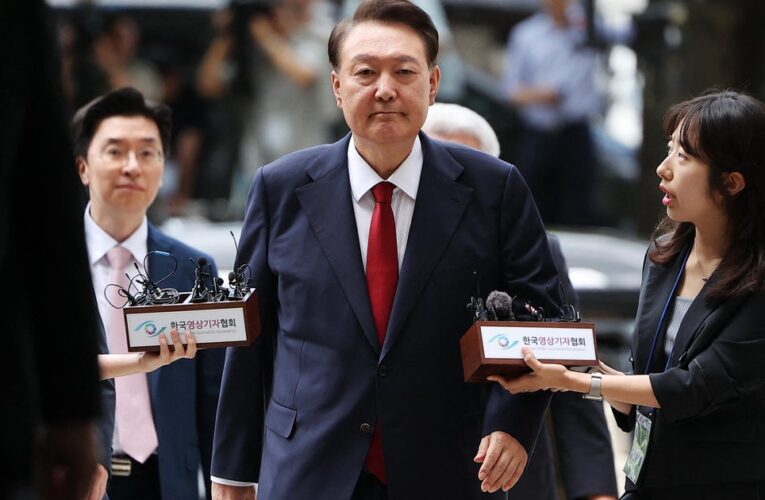 South Korea's jailed ex-leader resists questioning by taking off his clothes